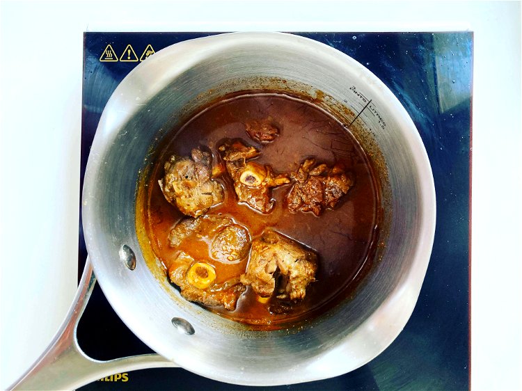 Image of Finish the tagineAdd the tagine gravy to the lamb in...