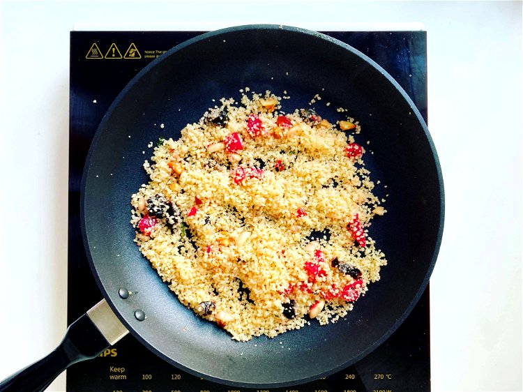 Image of Prepare the couscousIn another nonstick pan, melt the garlic butter...