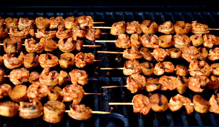 Image of To cook the skewers, place over medium heat on a...